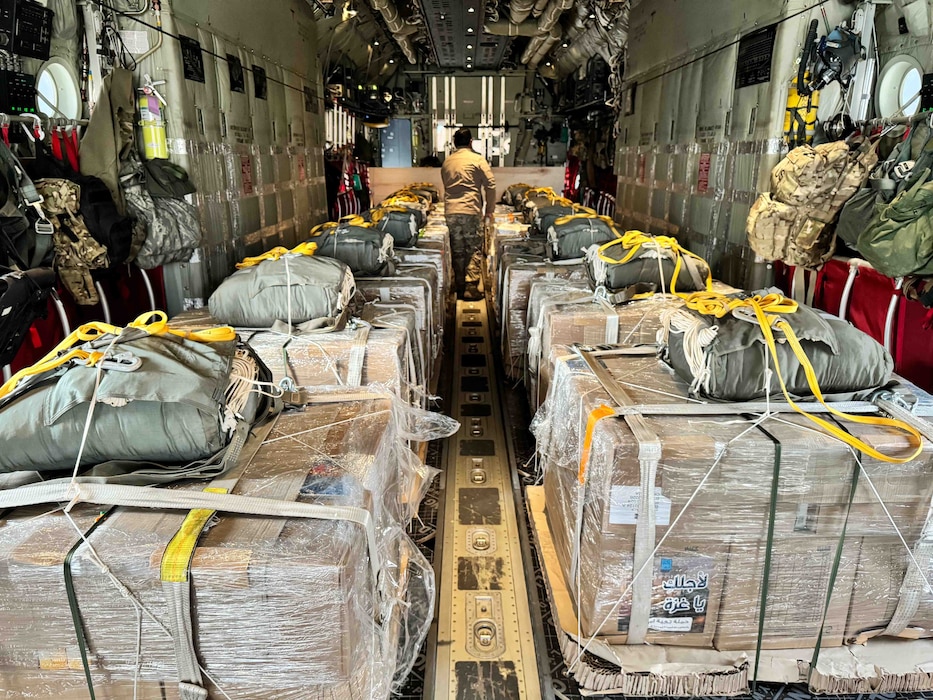 Jordanian-aid destined for Gaza awaits delivery on a HC-130J aircraft.