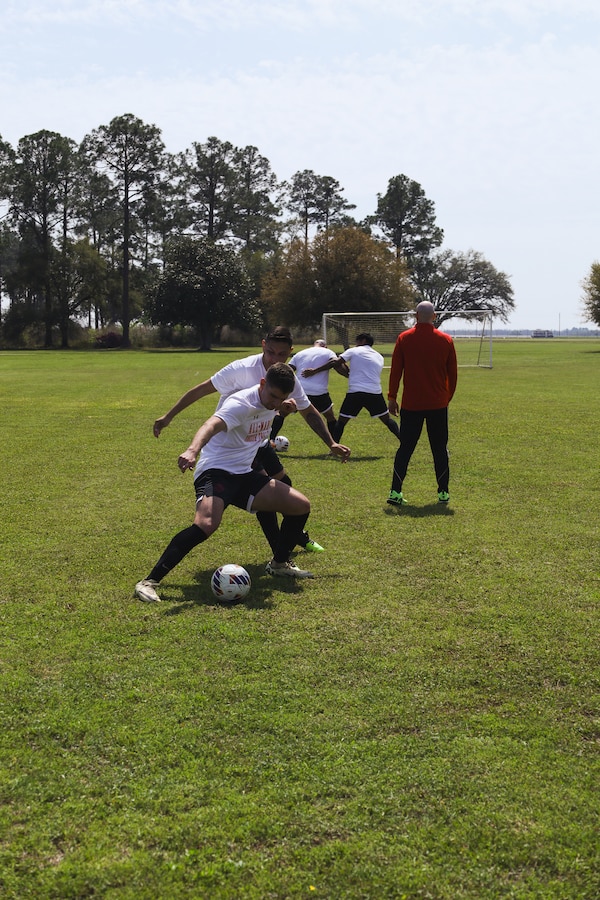 U.S. Marines with the Marine Corps soccer team practice at Marine Corps Logistics Base Albany, Georgia, March 21, 2024.  The USMC soccer team is one of the many teams from the Marine Corps Sports Programs, which enables exceptional Marine athletes to compete and play sports they are passionate about and enhance the fitness and resilience of Marines. (U.S. Marine Corps photo by Cpl. Mason Coots)