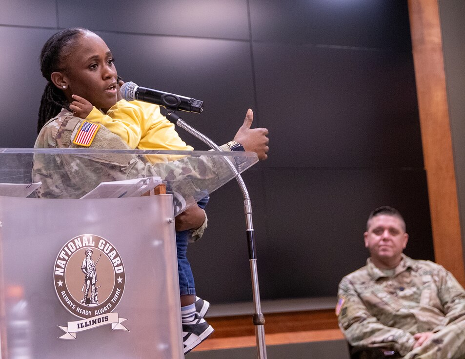 Newly promoted Illinois Army National Guard Capt. Mikaya Thomas, of Champaign, commander of Headquarters and Headquarters Company, 129th Regiment (Regional Training Institute) thanks family, friends, and fellow Soldiers for their support during her nine years of service during a promotion ceremony March 23 at the Illinois Military Academy, Camp Lincoln, Springfield.