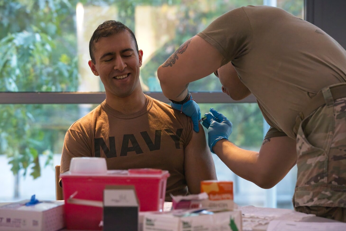 SILVER SPRING, Md. (Oct. 23, 2023) Lt. Rafae Khan, a Medical Corps officer from Naval Medical Research Command (NMRC), receives the seasonal flu vaccination. Flu vaccines were administered to military members and beneficiaries during a joint flu shot drive hosted by Walter Reed Army Institute of Research. NMRC conducts medical research, development, testing, evaluation and surveillance to optimize health, operational readiness and performance of Navy, Marine Corps and joint force personnel; delivering world-class, operationally-relevant medical solutions to enhance warfighter readiness through research & development. (U.S. Navy photo by Mike Wilson/Released)