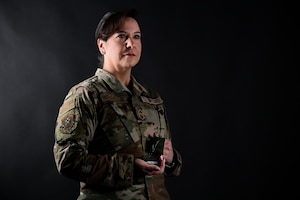 U.S. Air National Guard Chief Master Sgt. Patricia Pullar, senior enlisted leader for the 105th Airlift Wing's Operations Group, poses with Bataan Memorial Death March medal at Stewart Air National Guard Base, Newburgh, New York, March 22, 2024. Pullar completed her fourth Bataan Memorial Death March March 16 at White Sands Missile Range, New Mexico.