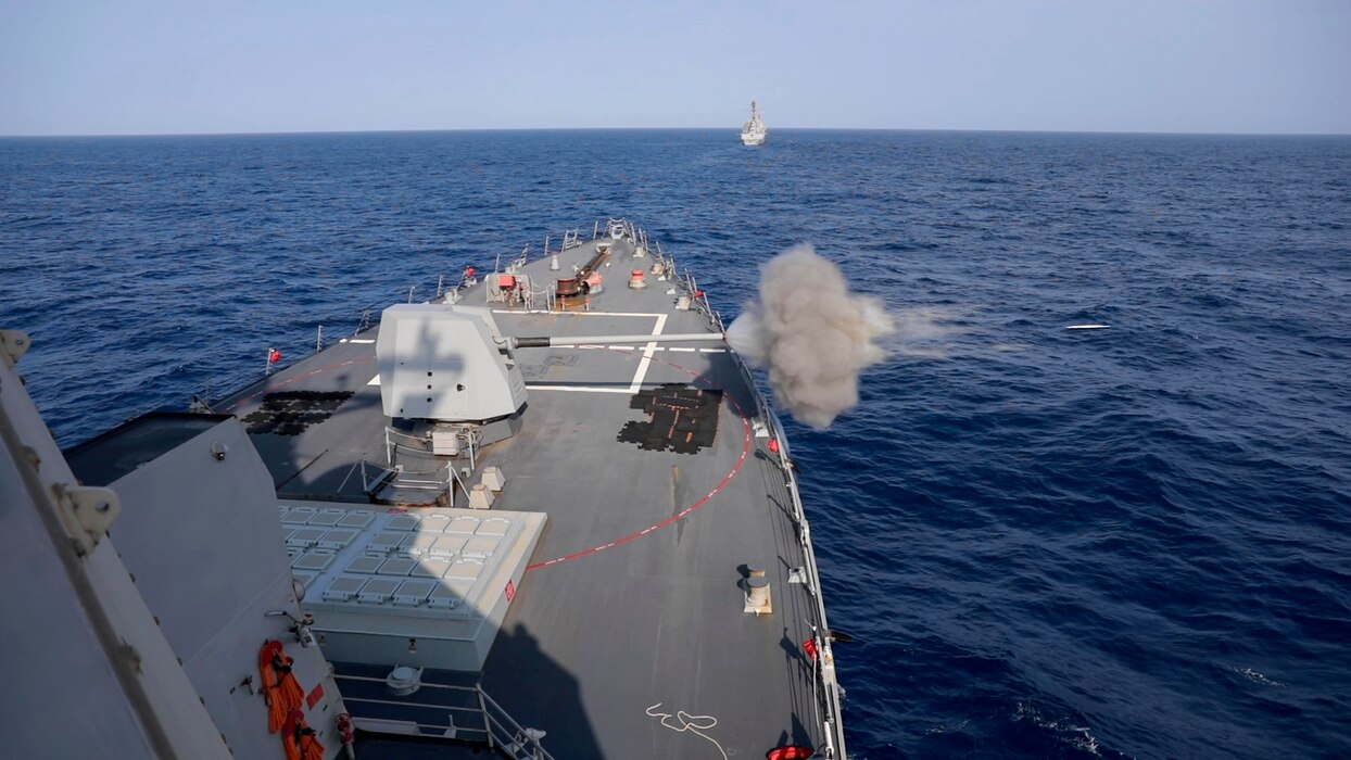 USS Ralph Johnson (DDG 114) conducts a live-fire exercise in the Philippine Sea.