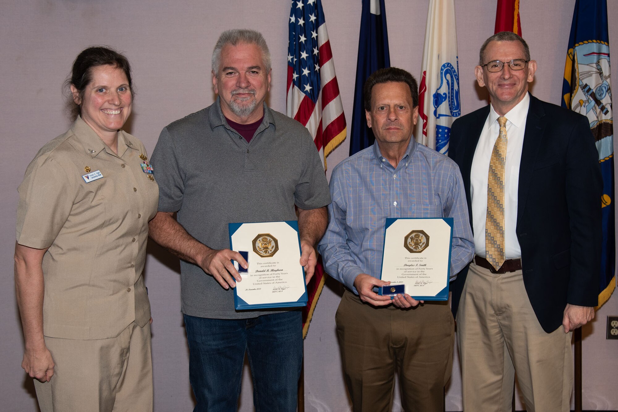 Forty Years of Federal Service presented to Donald Blagburn and Douglas Smith with CAPT Nigro and Mr. Reddy.
