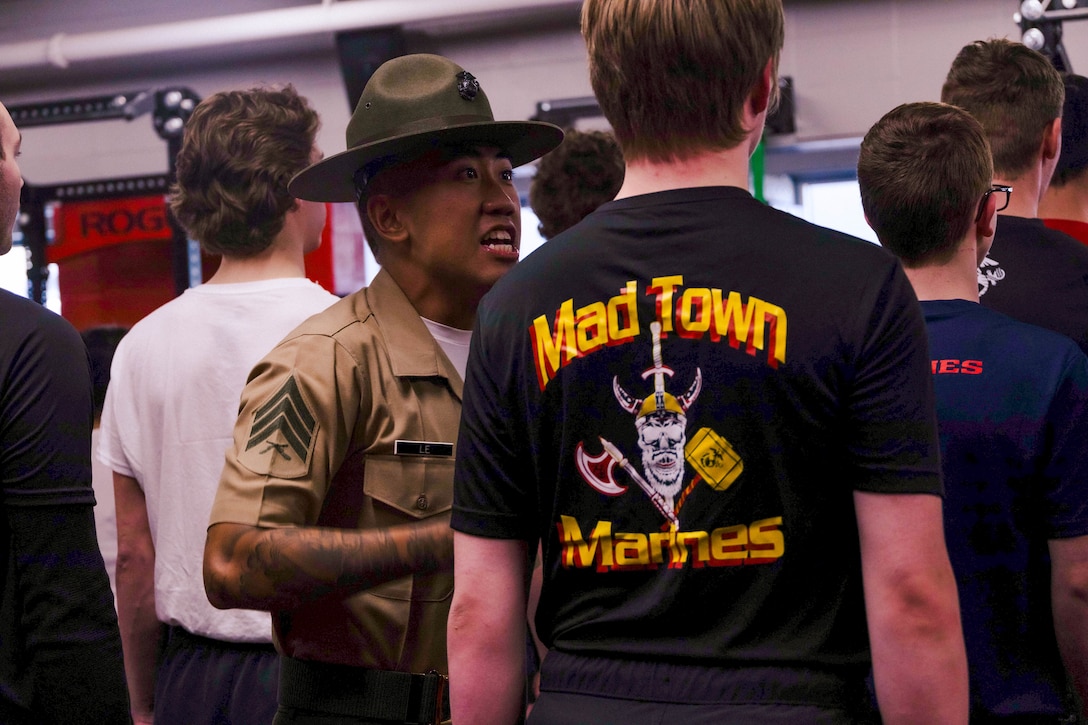 U.S. Marine Corps Sgt. Harry Le, a drill instructor with Bravo Company, 1st Recruit Training Battalion, corrects a poolee during Recruiting Sub-Station Madison’s Drill Instructor Night at Milton High School, Milton, WI, March 19, 2024. The purpose of Drill Instructor Night is to introduce poolees to incentive training, basic drill movements and give family and friends the opportunity to ask questions about recruit training and the Marine Corps. (U.S. Marine Corps photo by Cpl. Collette Hagen)