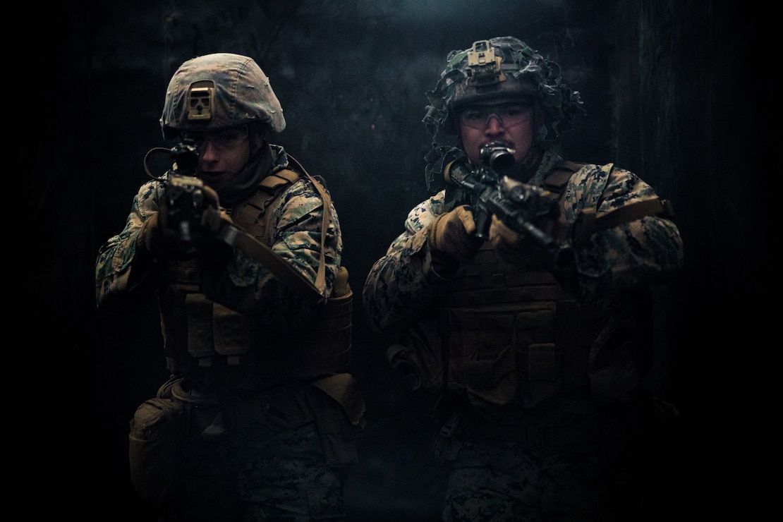 U.S. Marine Corps Lance Cpl. Matthew Pullman, left, and Cpl. Ryan Roberts, right, execute a close-quarters combat drill during Warrior Shield 24 at Rodriguez Live Fire Complex, Pocheon, South Korea, March 6, 2024. Warrior Shield 24 is an annual joint, combined exercise held on the Korean Peninsula that seeks to strengthen the combined defensive capabilities of ROK and U.S. forces. This routine, regularly scheduled, field training exercise provides the ROK and U.S. Marines the opportunity to rehearse combined operations, exchange knowledge, and demonstrate the strength and capabilities of the ROK-U.S. Alliance. Pullman, a native of South Carolina, and Roberts, a native of Pennsylvania, are mortarmen with 2nd Battalion 8th Marine Regiment and is forward deployed in the Indo-Pacific under 4th Marines, 3d Marine Division as part of the Unit Deployment Program.