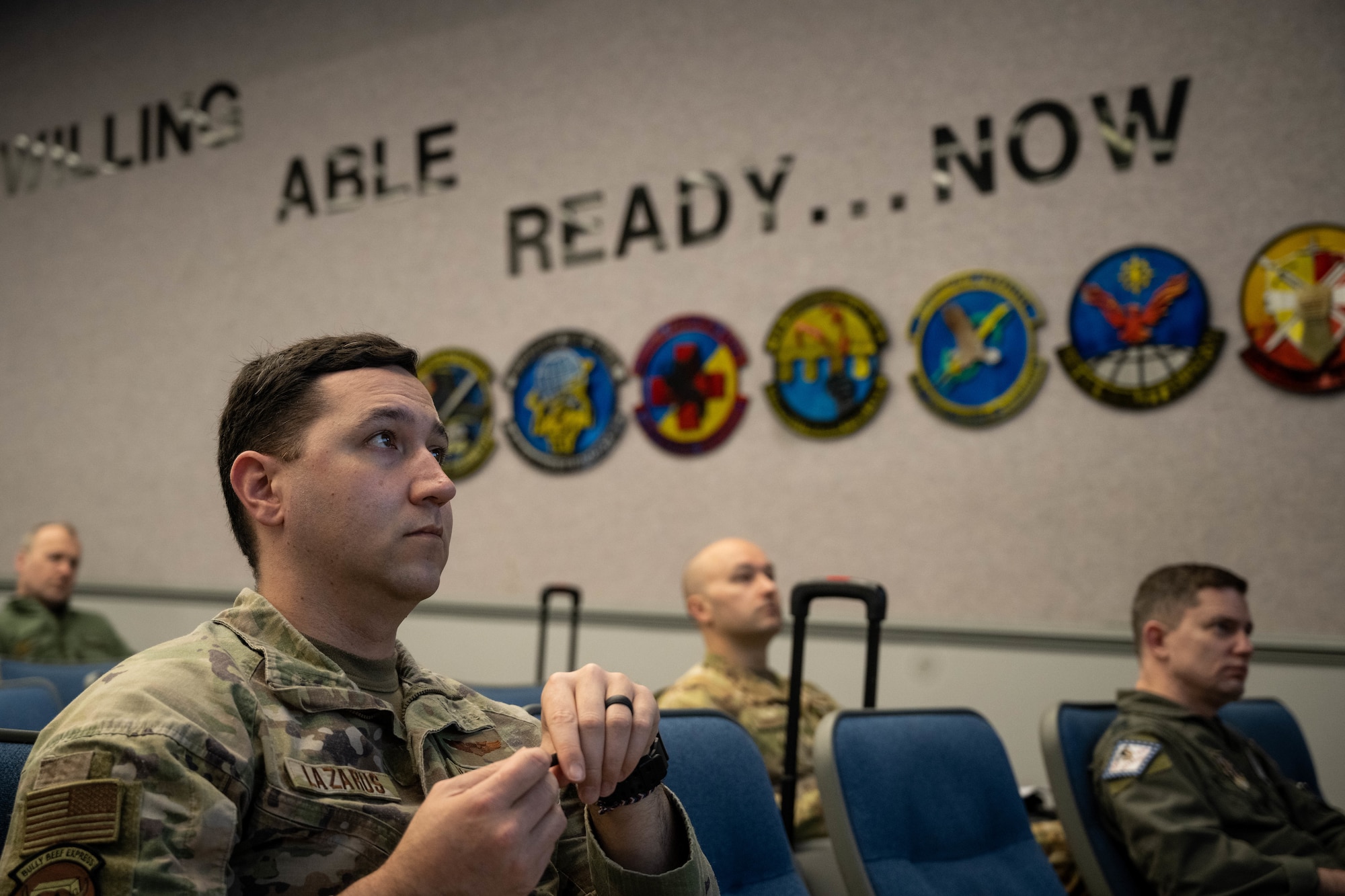 Airman listens to mission brief.