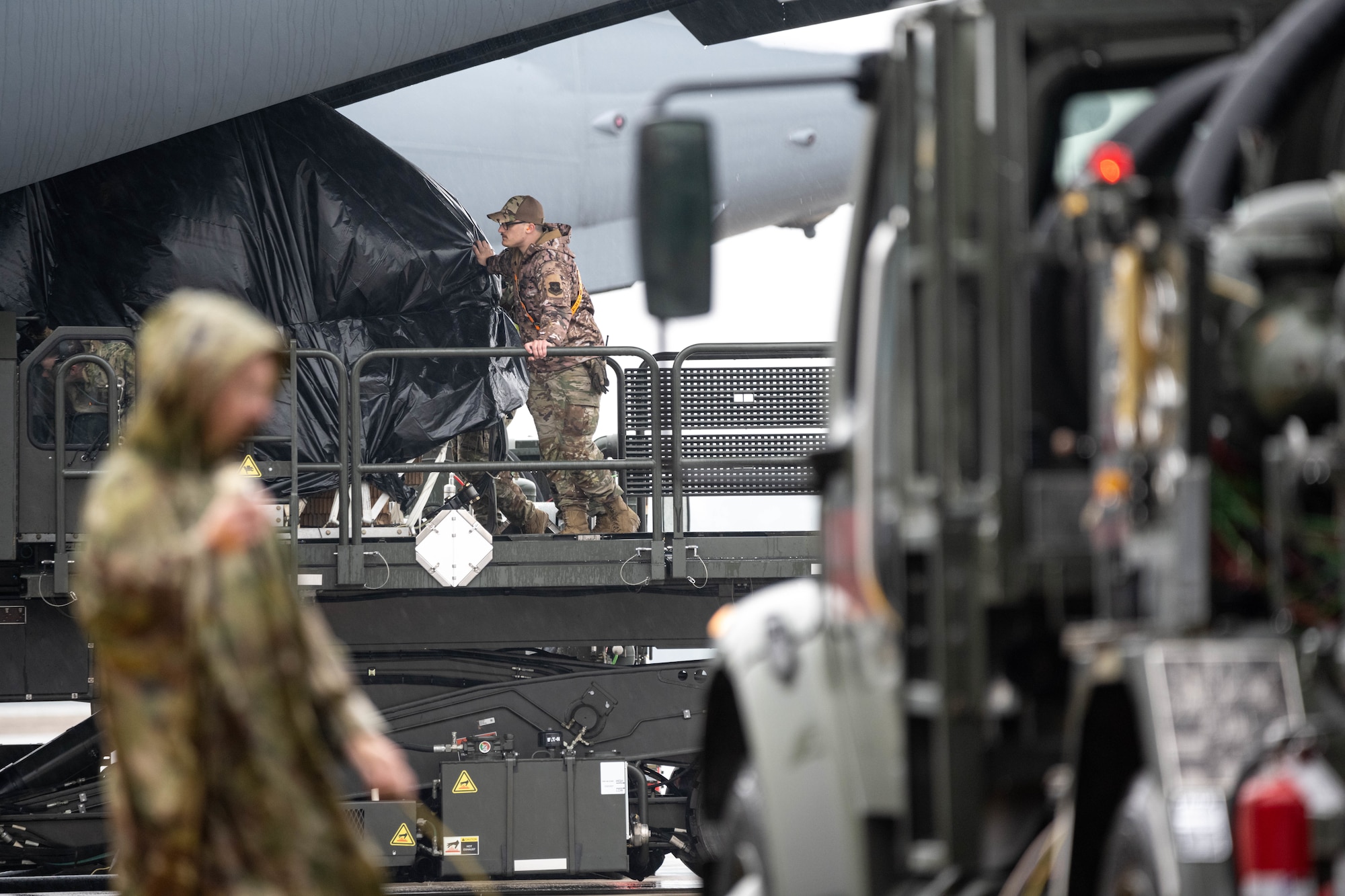 Airmen load assets into aircraft.