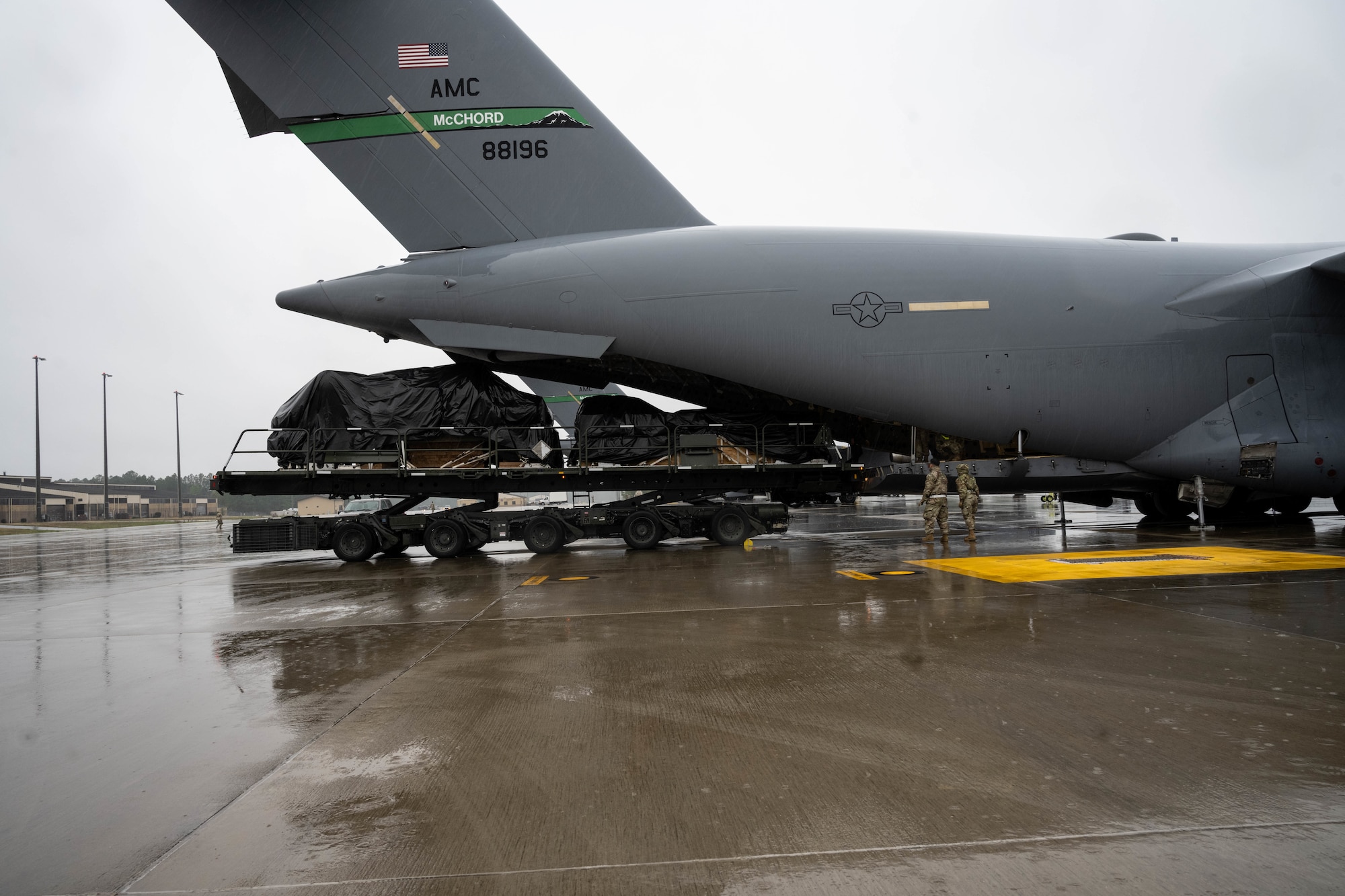 Aircraft being loaded with assets.