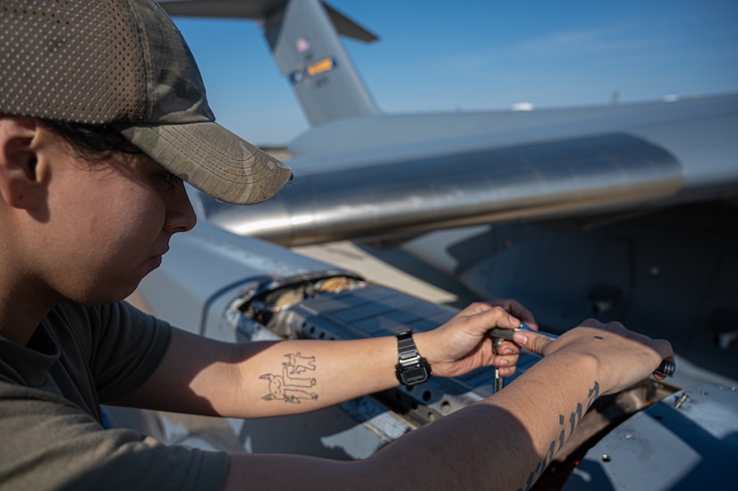U.S. Air Force Senior Airman Lylah Torres, 305th Aircraft Maintenance Squadron, adjusts panel on a C-17A Globemaster III at Joint Base McGuire-Dix-Lakehurst, N.J., March 14, 2024. The 305th AMXS was awarded the Maintenance Effectiveness Award in the Small Aircraft Maintenance Unit category, recognizing the squadron as one of the Air Force’s top-performing maintenance units. (U.S. Air Force photo by Senior Airman Simonne Barker)