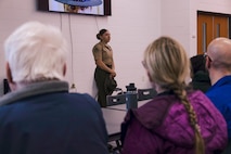 U.S. Marine Corps Staff Sgt. Katrina Jimenez, a senior drill instructor with Echo Company, 2nd Recruit Training Battalion, answers questions during Recruiting Sub-Station Madison’s Drill Instructor Night at Milton High School, Milton WI, March 19, 2024. The purpose of Drill Instructor Night is to introduce poolees to incentive training, basic drill movements and give family and friends the opportunity to ask questions about recruit training and the Marine Corps. (U.S. Marine Corps photo by Cpl. Collette Hagen)