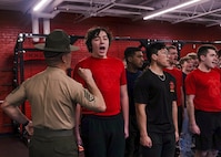 U.S. Marine Corps Staff Sgt. Kyle Craig, a drill instructor with Delta Company, 1st Recruit Training Battalion, corrects a poolee during Recruiting Sub-Station Madison’s Drill Instructor Night at Milton High School, Milton WI, March 19, 2024. The purpose of Drill Instructor Night is to introduce poolees to incentive training, basic drill movements and give family and friends the opportunity to ask questions about recruit training and the Marine Corps. (U.S. Marine Corps photo by Cpl. Collette Hagen)