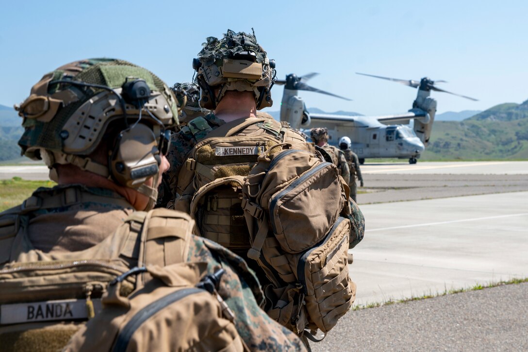 U.S. Marines assigned to Bravo Company, Battalion Landing Team 1/5, 15th Marine Expeditionary Unit, prepare to embark MV-22B Ospreys attached to Marine Medium Tiltrotor Squadron (VMM) 165 (Reinforced), during training at Marine Corps Base Camp Pendleton, California, March 21, 2024. The Marine Corps returned MV-22s to flight status on March 8, 2024. VMM-165 (Rein.) is conducting deliberate, progressive training focused on the reintegration of MV-22s to the 15th MEU’s Marine Air-Ground Task Force as pilots and air crews achieve proficiency. (U.S. Marine Corps photo by Cpl. Luis Agostini)