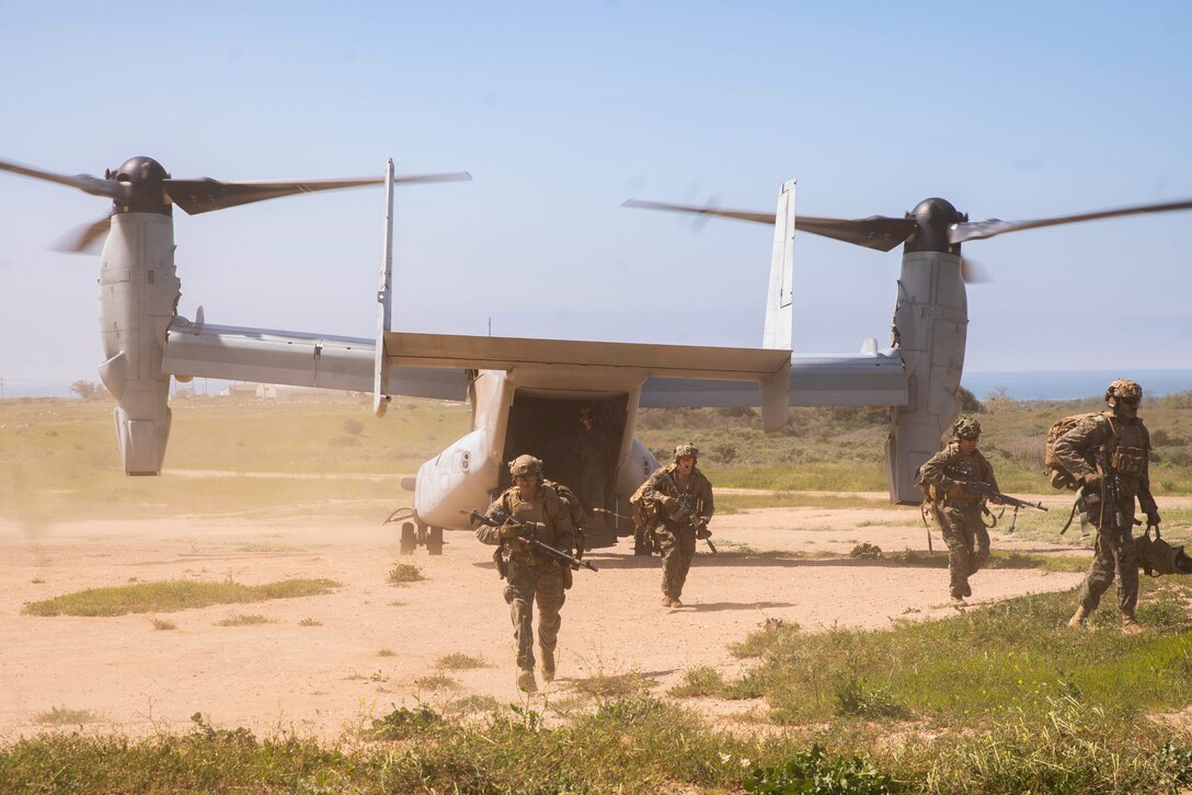 U.S. Marines assigned to Bravo Company, Battalion Landing Team 1/5, 15th Marine Expeditionary Unit, disembark an MV-22B Osprey attached to Marine Medium Tiltrotor Squadron (VMM) 165 (Reinforced) 15th MEU, at a landing zone during training at Marine Corps Base Camp Pendleton, California, March 21, 2024. The Marine Corps returned MV-22s to flight status on March 8, 2024. VMM-165 (Rein.) is conducting deliberate, progressive training focused on the reintegration of MV-22s to the 15th MEU’s Marine Air-Ground Task Force as pilots and air crews achieve proficiency. (U.S. Marine Corps photo by Cpl. Luis Agostini)