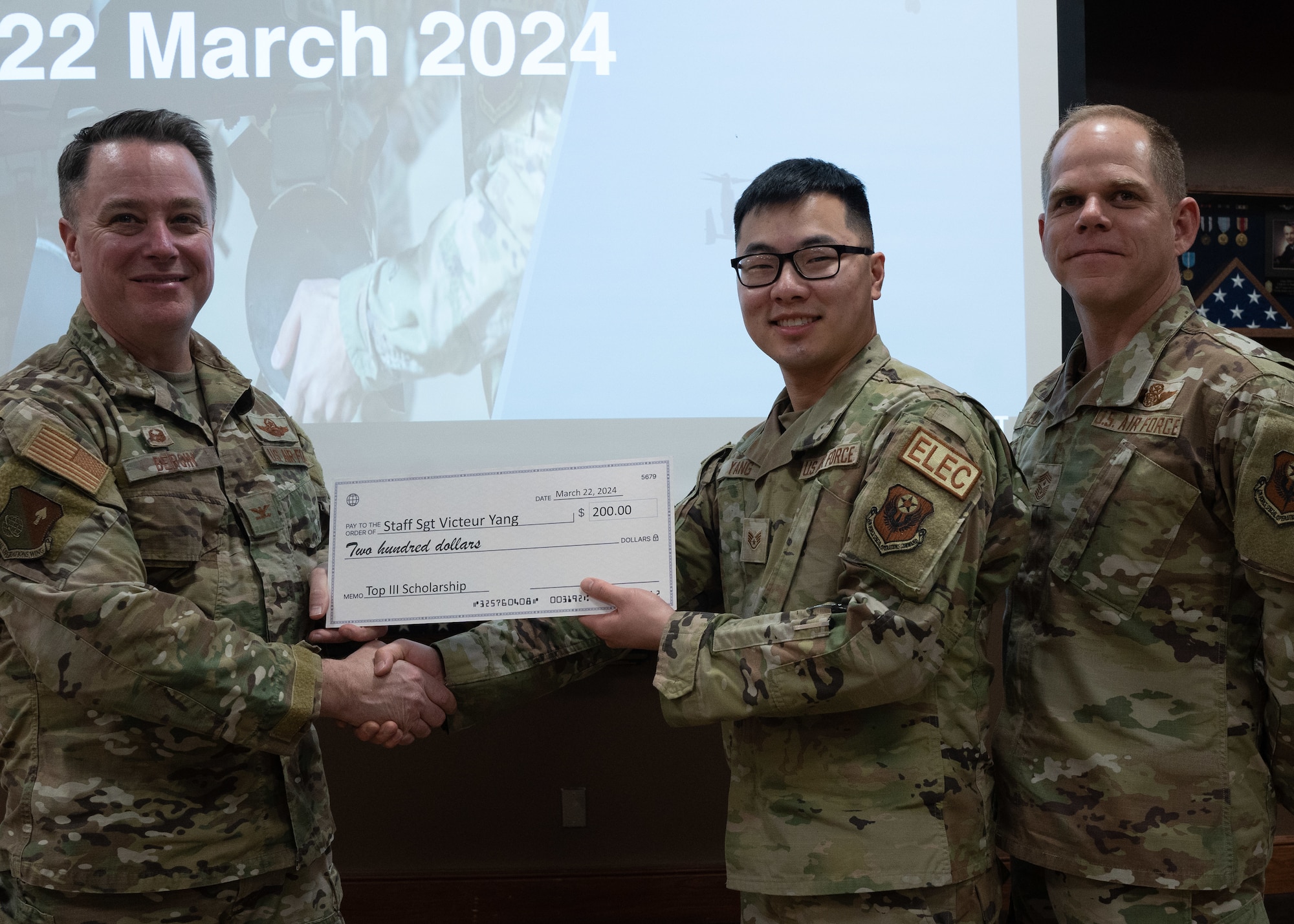 U.S Air Force Staff Sgt. Victeur Yang, assigned to
the 27th Special Operations Civil Engineer
Squadron, receives an award from U.S. Air Force
Col. Jeremy Bergin, 27th Special Operations Wing
commander at Cannon Air Force Base, N.M.,
March 22, 2024. The BCC focuses on continuing
the strong tradition of community involvement
and support. (U.S Air Force Photo by Senior Airman Mateo Parra)