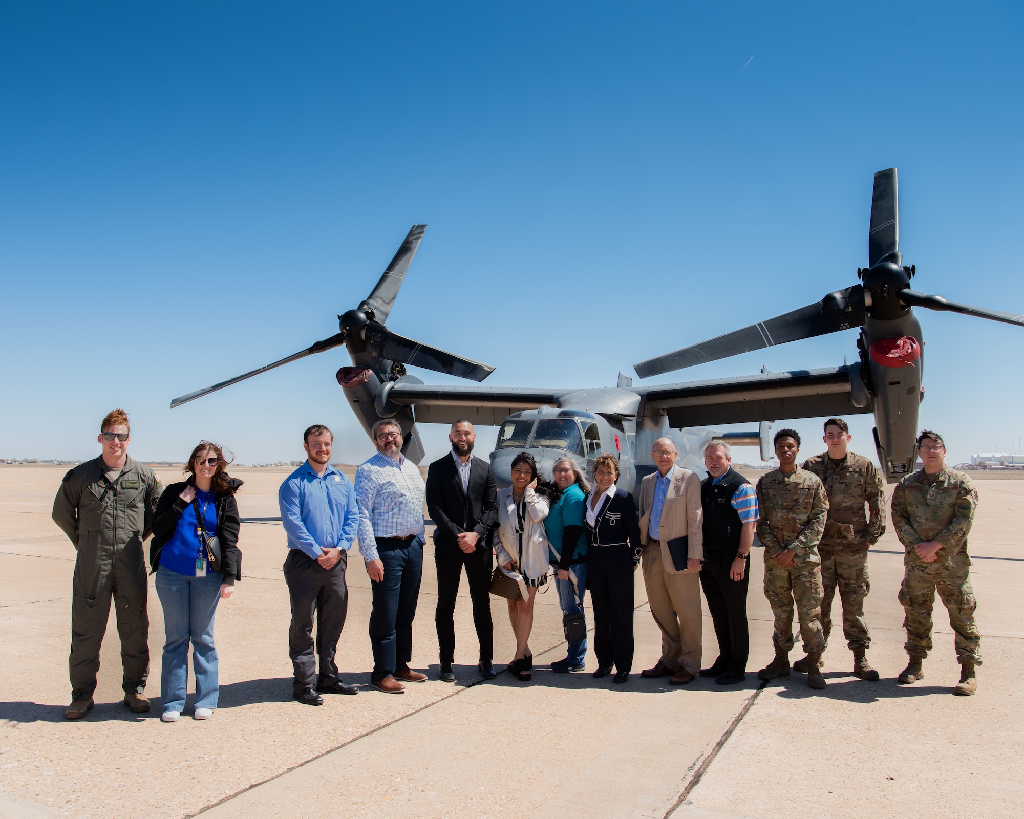 U.S Air Force Airmen from the 27th Special
Operations Wing and community members with
the Base Community Council take a photo in front
of a CV-22 Osprey at Cannon Air Force Base,
N.M., March 22, 2024. The BCC’s vision has
provided Air Commandos and community
members an action-oriented forum that can bridge
our military and local communities through
common understanding and shared activities. (U.S
Air Force Photo by Tech Sgt. Kaylee Clark)