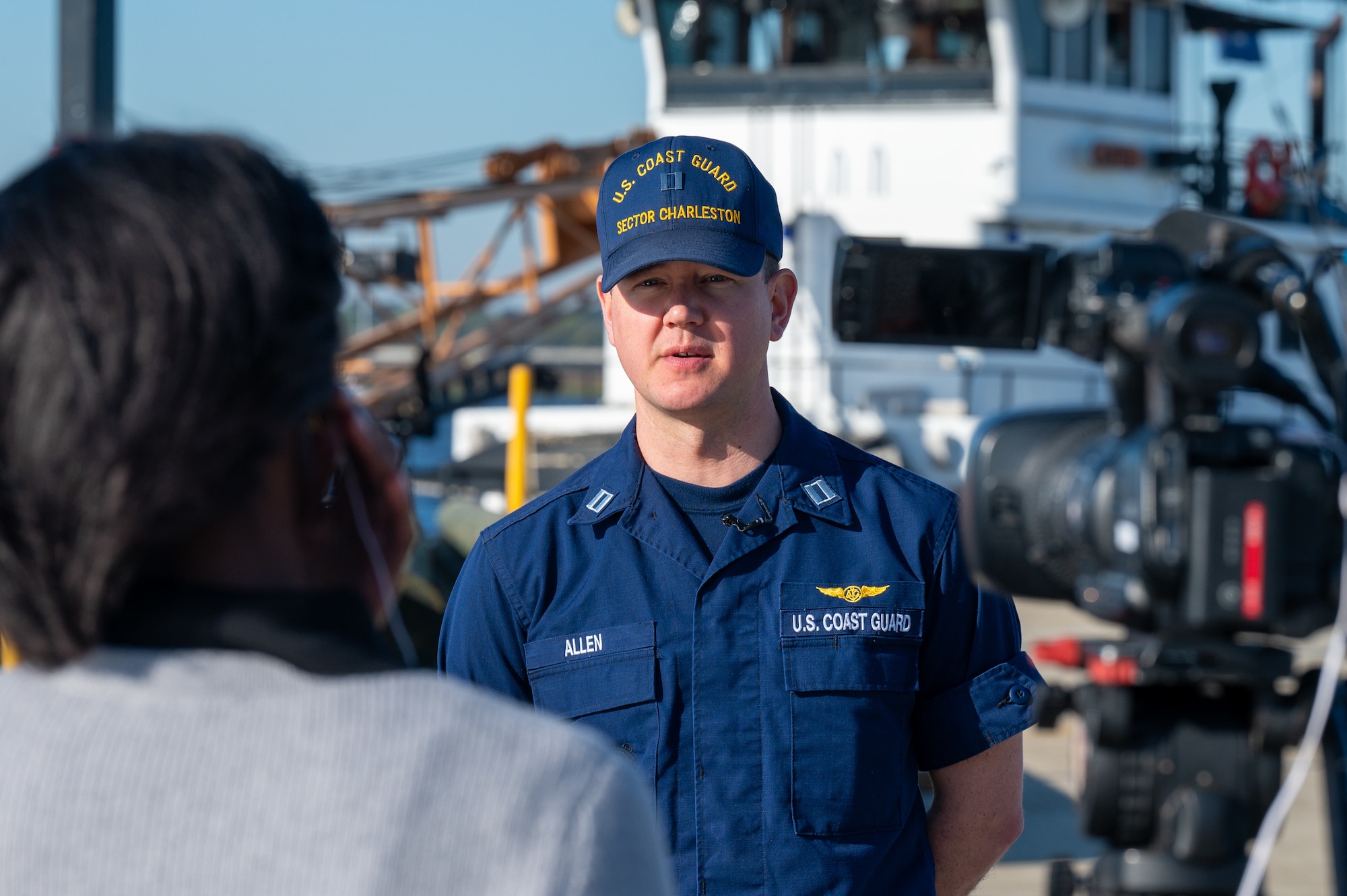 A photo of a man in front of a camera.