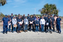 A photo of several people posing for a picture.