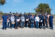 A photo of several people posing for a picture.