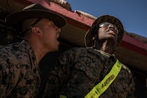 U.S. Marine Corps Sgt. Joe Huerta, a drill instructor provides instruction to Recruit Yavin Nesbesth, both with Alpha Company, 1st Recruit Training Battalion, during the table one course of fire at Marine Corps Base Camp Pendleton, California, March 19, 2024. The table one course of fire is designed to introduce recruits to the basic fundamentals of marksmanship and rifle safety. (U.S. Marine Corps photo by Cpl. Sarah M. Grawcock)