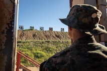 U.S. Marine Corps Recruit Cameran Coleman with Alpha Company, 1st Recruit Training Battalion, waits to pull down targets in the pits during the table one course of fire at Marine Corps Base Camp Pendleton, California, March 19, 2024. The table one course of fire is designed to introduce recruits to the basic fundamentals of marksmanship and rifle safety. (U.S. Marine Corps photo by Cpl. Sarah M. Grawcock)