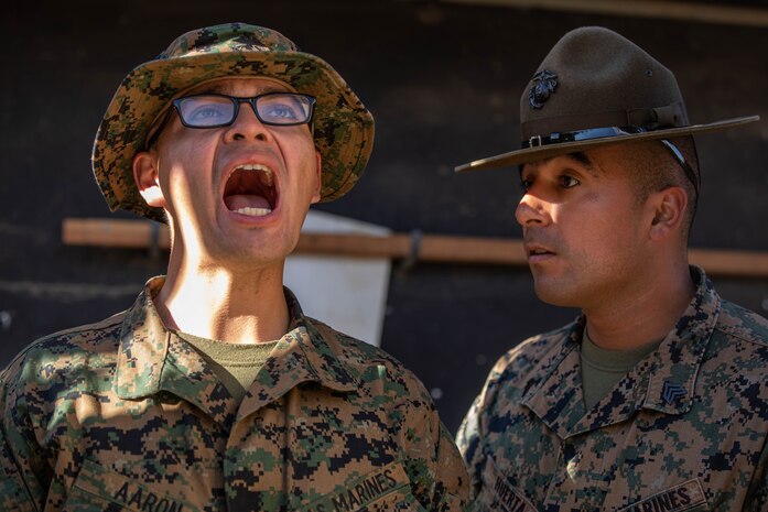 U.S. Marine Corps Sgt. Joe Huerta, a drill instructor provides instruction to Recruit Julien Aaron both with Alpha Company, 1st Recruit Training Battalion, during the table one course of fire at Marine Corps Base Camp Pendleton, California, March 19, 2024. The table one course of fire is designed to introduce recruits to the basic fundamentals of marksmanship and rifle safety. (U.S. Marine Corps photo by Cpl. Sarah M. Grawcock)