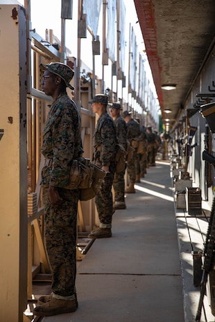 U.S. Marine Corps recruits with Alpha Company, 1st Recruit Training Battalion, wait to pull down targets in the pits during the table one course of fire at Marine Corps Base Camp Pendleton, California, March 19, 2024. The table one course of fire is designed to introduce recruits to the basic fundamentals of marksmanship and rifle safety. (U.S. Marine Corps photo by Cpl. Sarah M. Grawcock)