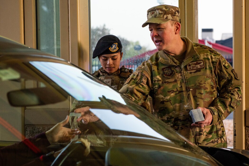 General hands out mental health information to motorists.