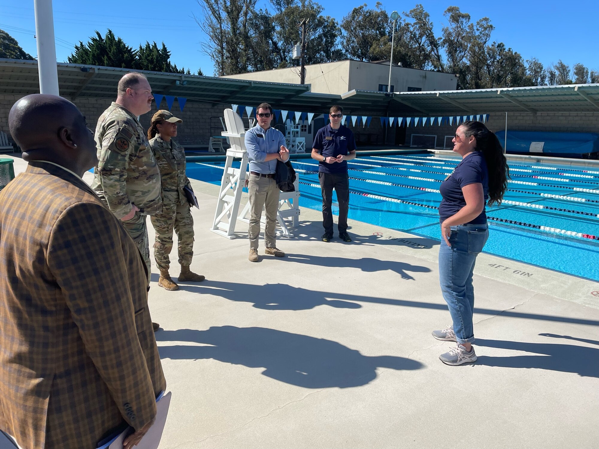 The U.S. Air Force Air Force Manpower, Personnel & Services Maj. Gen. Eugene L. Eubank Award evaluation team speaks to 30th Force Support Squadron personnel who maintain the base pool at Vandenberg Space Force Base, Calif., March 19, 2024. The 30th Force Support Squadron has been selected as one of two finalists to compete for the award and was evaluated on their ability to support units, demonstrate outstanding professionalism and commitment to world class customer service, and the ability to innovate and perform beyond typical expectations. (Courtesy Photo)