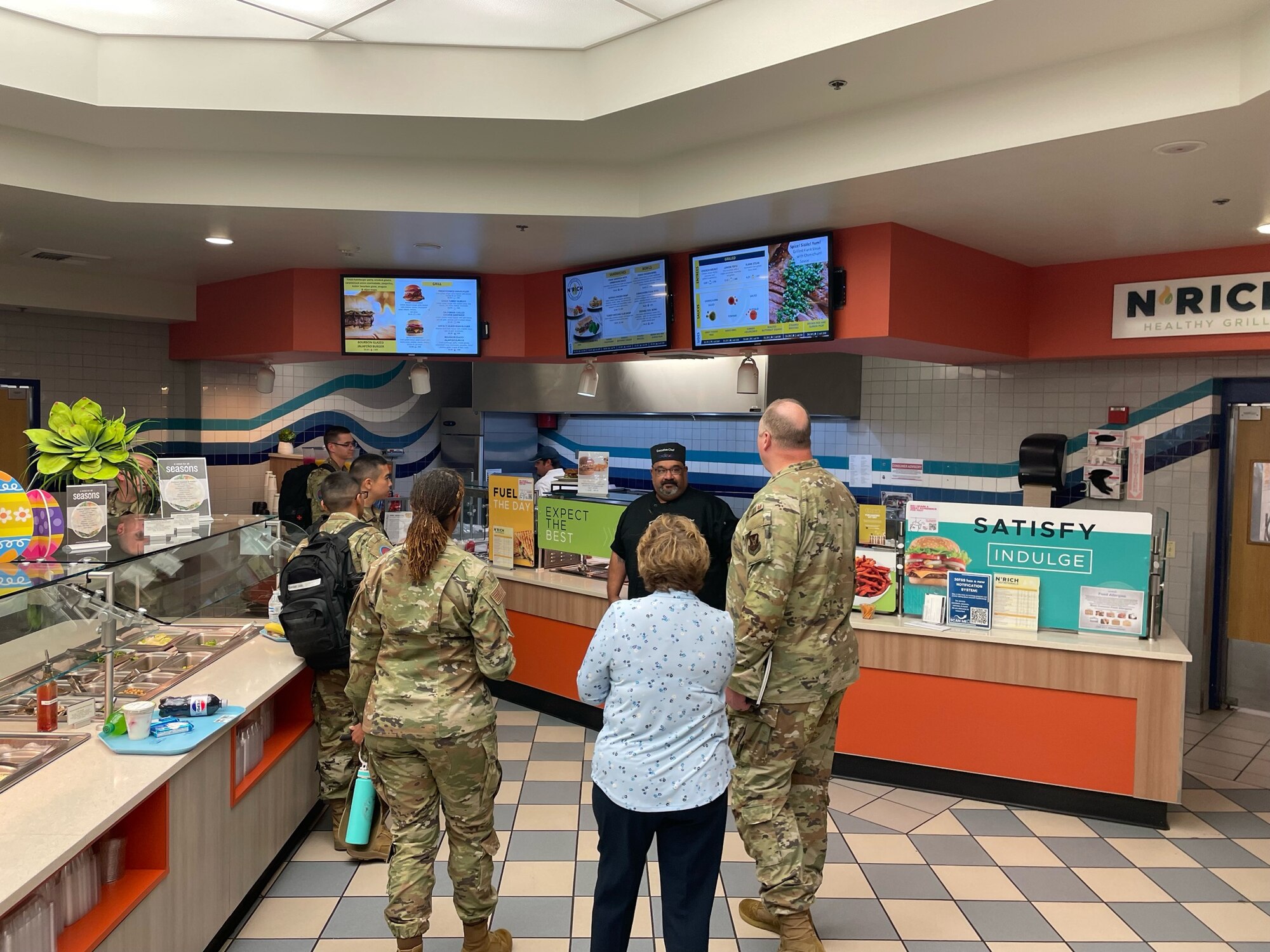 The U.S. Air Force Air Force Manpower, Personnel & Services Maj. Gen. Eugene L. Eubank Award evaluation team speaks to 30th Force Support Squadron personnel who maintain the Vandenberg Dining Facility at Vandenberg Space Force Base, Calif., March 19, 2024. The 30th Force Support Squadron has been selected as one of two finalists to compete for the award. (Courtesy Photo)
