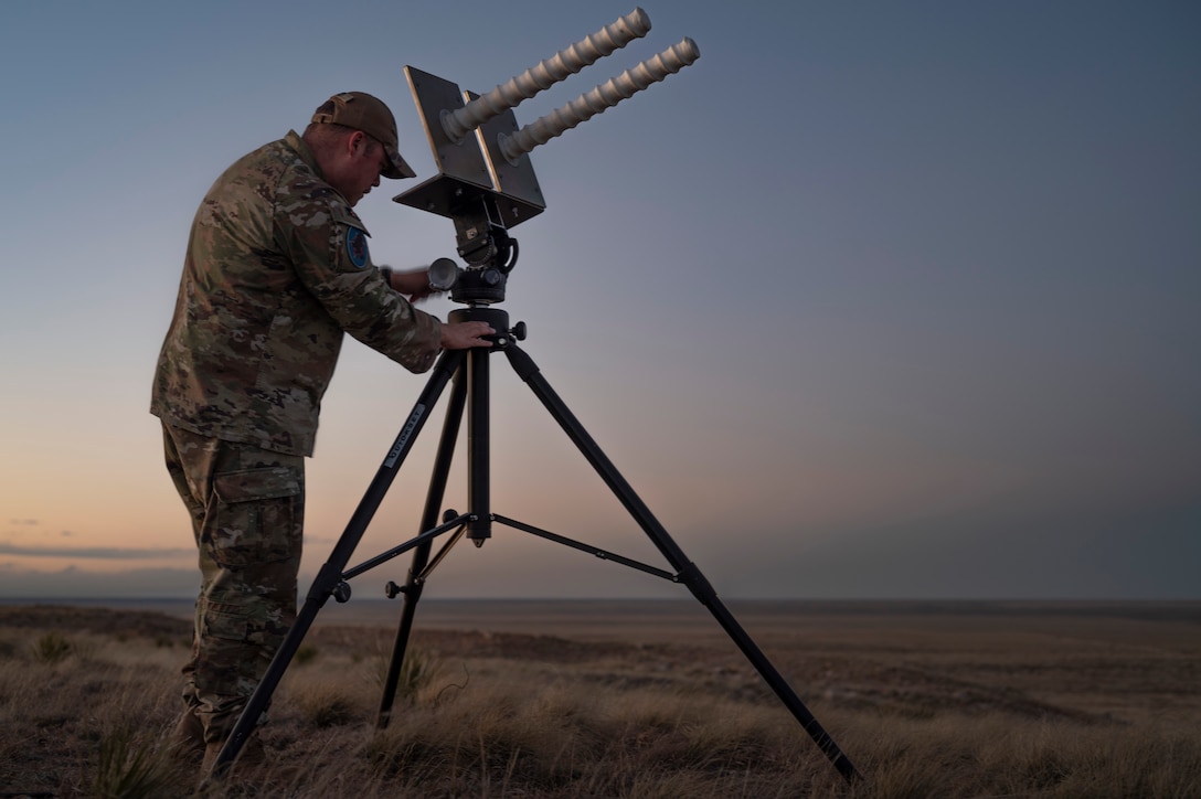 U.S. Space Force Tech Sgt. Kyle Yeager, flight chief of the 527th Space Aggressor Maintenance Flight and certified GPS operator, adjusts the tilt of the helical antenna in preparation for training exercise with the AC-130J Ghostrider at Cannon Air Force Base, New Mexico on March 5, 2024.