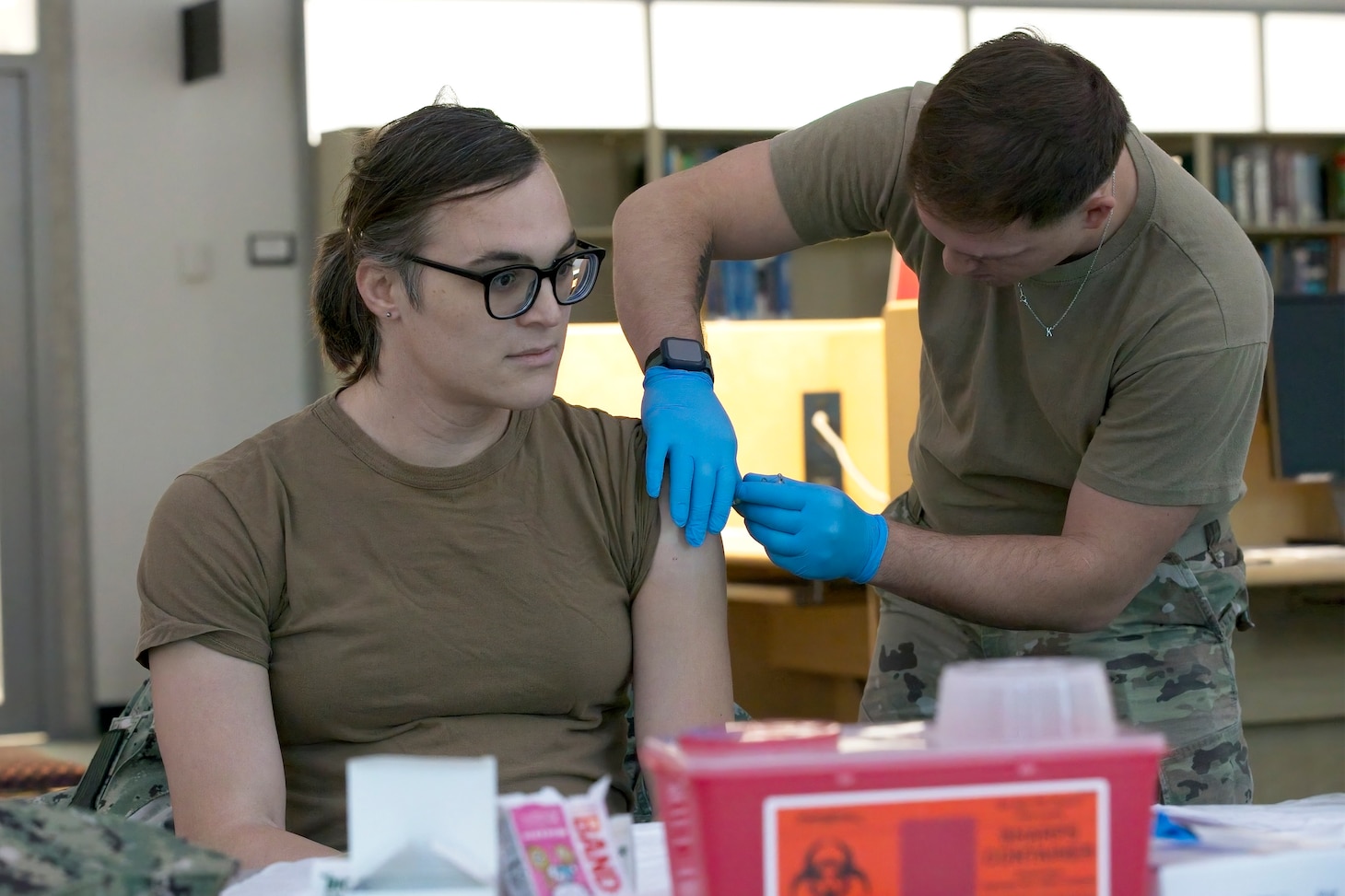 SILVER SPRING, Md. (Oct. 23, 2023) Machinist's Mate (nuclear) 1st Class Vivian Jaquith, from Naval Medical Research Command (NMRC), receives a seasonal flu vaccination. Flu vaccines were administered to military members and beneficiaries during a joint flu shot drive hosted by Walter Reed Army Institute of Research. NMRC conducts medical research, development, testing, evaluation and surveillance to optimize health, operational readiness and performance of Navy, Marine Corps and joint force personnel; delivering world-class, operationally-relevant medical solutions to enhance warfighter readiness through research & development. (U.S. Navy photo by Mike Wilson/Released)