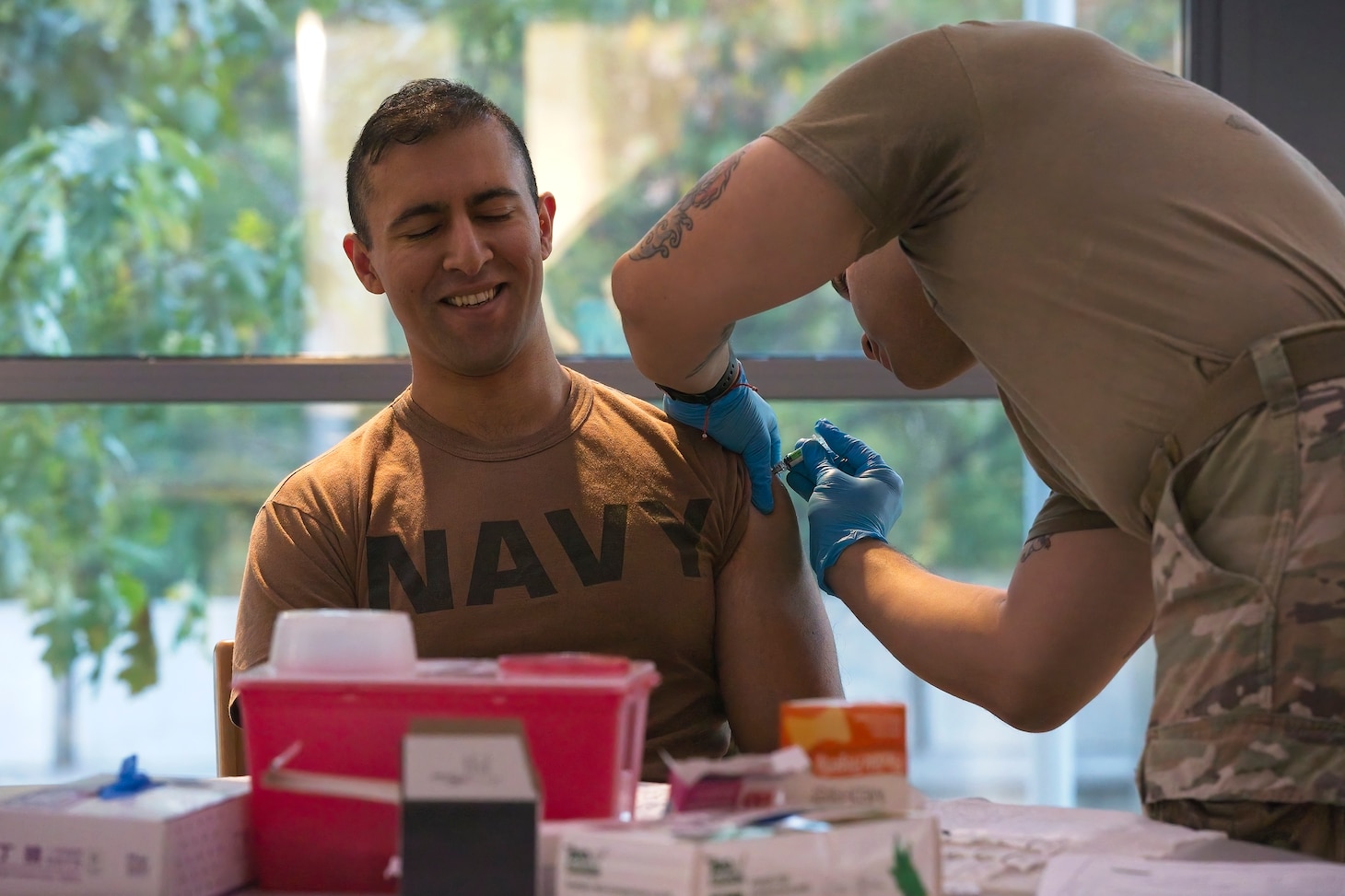 SILVER SPRING, Md. (Oct. 23, 2023) Lt. Rafae Khan, a Medical Corps officer from Naval Medical Research Command (NMRC), receives the seasonal flu vaccination. Flu vaccines were administered to military members and beneficiaries during a joint flu shot drive hosted by Walter Reed Army Institute of Research. NMRC conducts medical research, development, testing, evaluation and surveillance to optimize health, operational readiness and performance of Navy, Marine Corps and joint force personnel; delivering world-class, operationally-relevant medical solutions to enhance warfighter readiness through research & development. (U.S. Navy photo by Mike Wilson/Released)