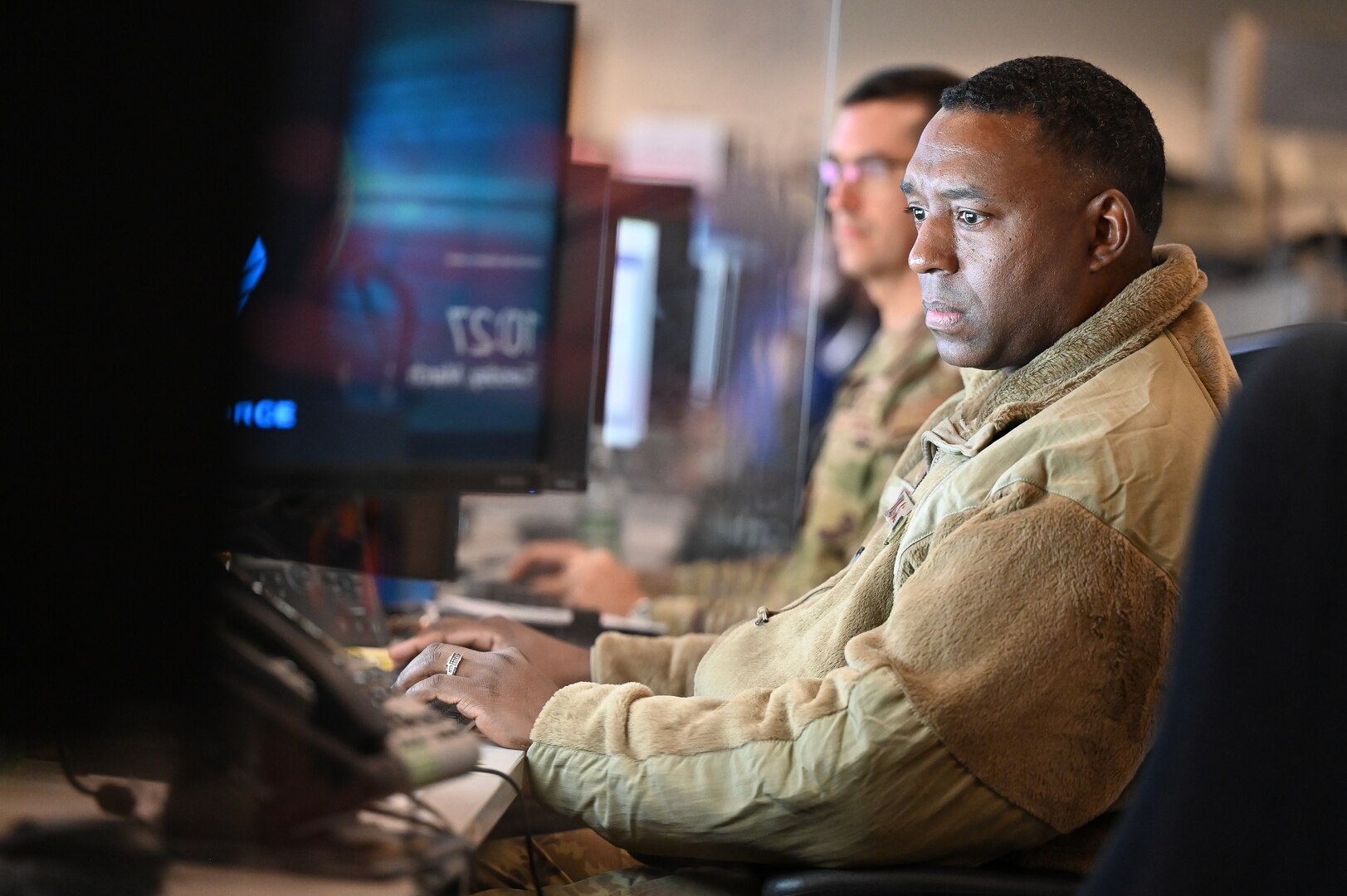 Airman types on a computer during the exercise