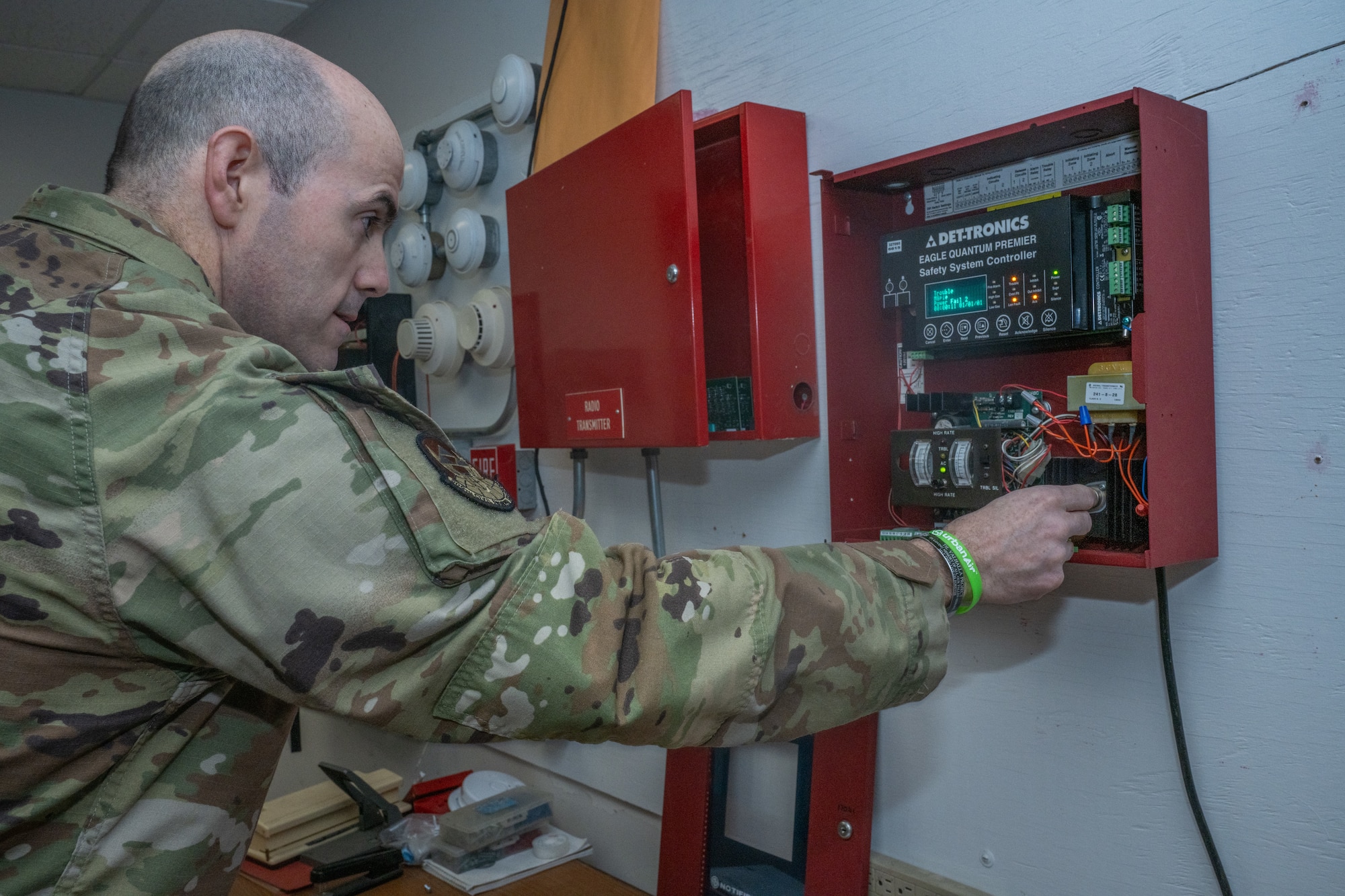 U.S. Air Force Staff Sgt. Jared Clark, 509th Civil Engineer Squadron electrical technician reviews a training model for the safety system controller at Whiteman Air Force Base, Mo., March 1, 2024. The training model allows Airmen and civilians in the FAST shop to exercise their abilities dealing with fire alarms. (U.S. Air Force photo by Airman 1st Class Hailey Farrell)