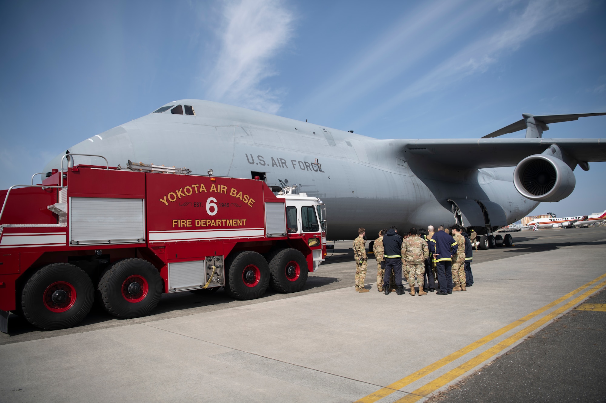 Firefighters from the 374th Civil Engineering Squadron convene during egress training.