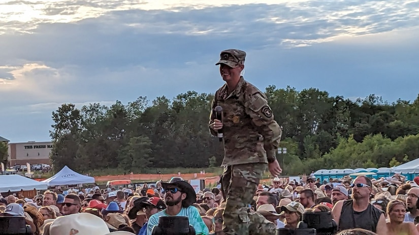 Female Soldier on stage at a county fair