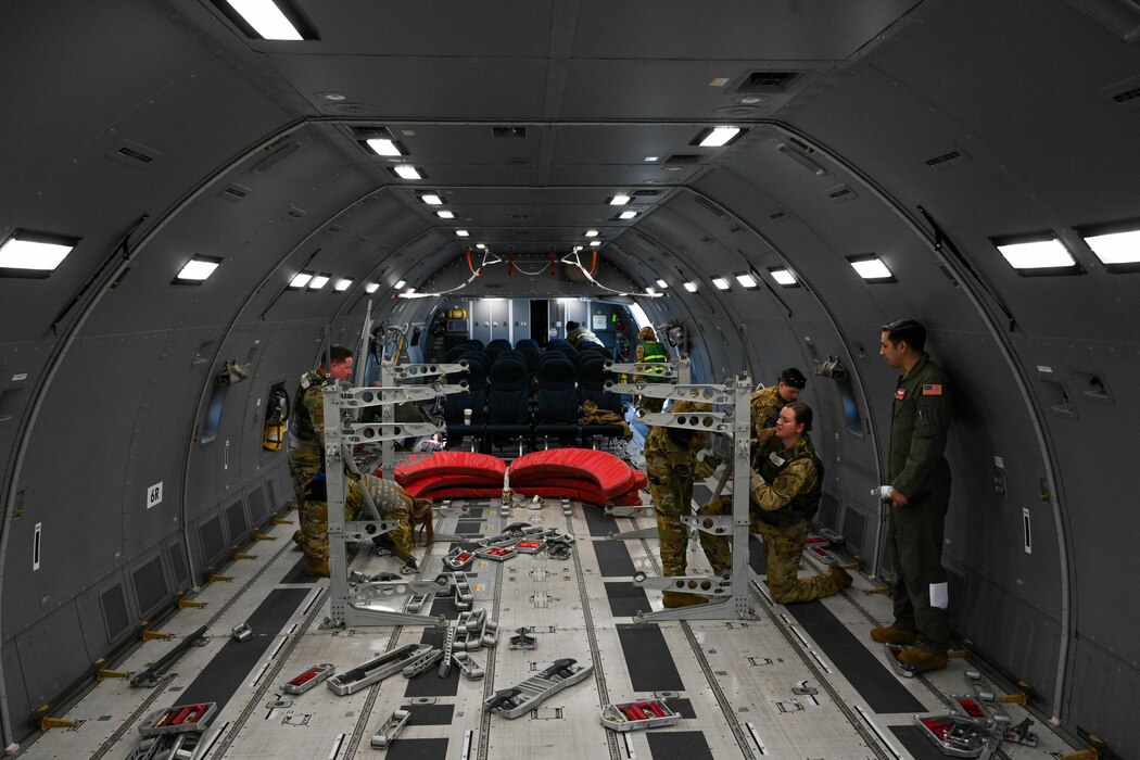 Airmen from the 375th Air Mobility Wing put together racking systems in the cargo area of a KC-46 Pegasus during Combat Cardinal 2024 at Scott Air Force Base, Illinois, March 13, 2024. Combat Cardinal is a series of exercises meant to enhance the wing’s ability to rapidly deploy. (U.S. Air Force photo by Senior Airman Trenton Jancze)