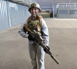 Brittney Wieland tests out the newest body armor on an obstacle course.