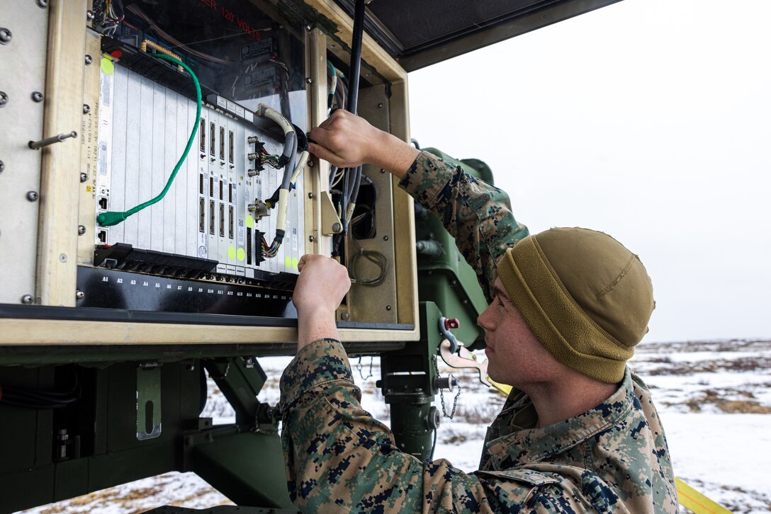 U.S. Marine Corps Cpl. Jayden Gimbi, a native of Wisconsin and an air traffic control radar technician with Marine Air Control Squadron (MACS) 2, 2nd Marine Aircraft Wing, performs maintenance on an air traffic navigation, integration, and coordination system during Exercise Nordic Response 24 at Andenes, Norway, March 14, 2024. Exercise Nordic Response is designed to enhance military capabilities and allied cooperation in high-intensity warfighting scenarios under challenging arctic conditions, while providing U.S. Marines unique opportunities to train alongside NATO allies and partners. (U.S. Marine Corps photo by Cpl. Christopher Hernandez)