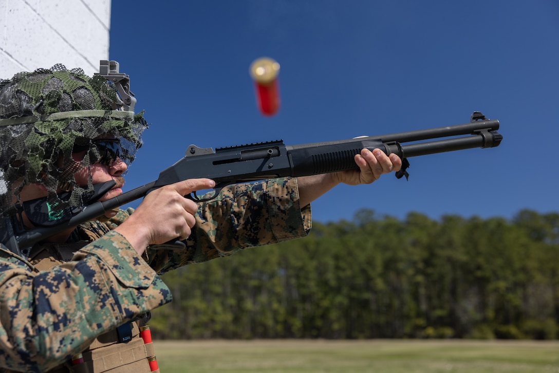 U.S. Marine Corps Cpl. Samuel Lesley, a native of Alabama and a low-altitude air-defense (LAAD) gunner with 2nd LAAD Battalion, Marine Air Control Group 28, 2nd Marine Aircraft Wing, fires at a clay pigeon during a shotgun familiarization course at Marine Corps Air Station Cherry Point, North Carolina, March 21, 2024. This range was part of 2nd LAAD’s development of new tactics, techniques, and procedures to increase capabilities in counter-unmanned aircraft systems operations. (U.S. Marine Corps photo by Cpl. Adam Henke)