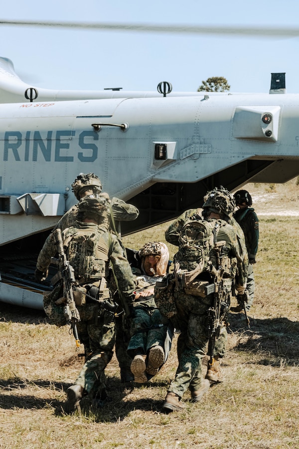 Dutch Marines with Marine Squadron Carib, Netherlands Marine Corps load a simulated casualty onto a CH-53K Super Stallion during Exercise Caribbean Urban Warrior on Camp Lejeune, North Carolina, March 20, 2024. Exercise Caribbean Urban Warrior is a bilateral training evolution designed to increase global interoperability between 2d Marine Division and Marine Squadron Carib. (U.S. Marine Corps photo by Lance Cpl. Emma Gray)