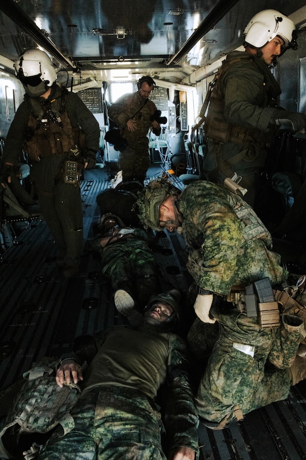 Dutch Marines with Marine Squadron Carib, Netherlands Marine Corps treat simulated casualties on a CH-53K Super Stallion during Exercise Caribbean Urban Warrior on Camp Lejeune, North Carolina, March 20, 2024. Exercise Caribbean Urban Warrior is a bilateral training evolution designed to increase global interoperability between 2d Marine Division and Marine Squadron Carib. (U.S. Marine Corps photo by Lance Cpl. Emma Gray)