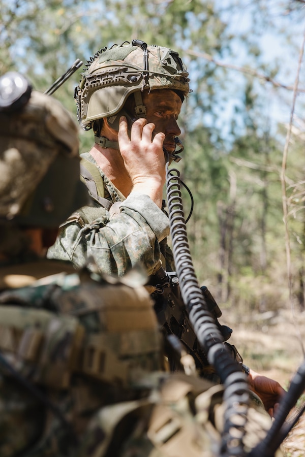 A Dutch Marine with Marine Squadron Carib, Netherlands Marine Corps calls for fire during Exercise Caribbean Urban Warrior on Camp Lejeune, North Carolina, March 21, 2024. Exercise Caribbean Urban Warrior is a bilateral training evolution designed to increase global interoperability between 2d Marine Division and Marine Squadron Carib. (U.S. Marine Corps photo by Lance Cpl. Emma Gray)