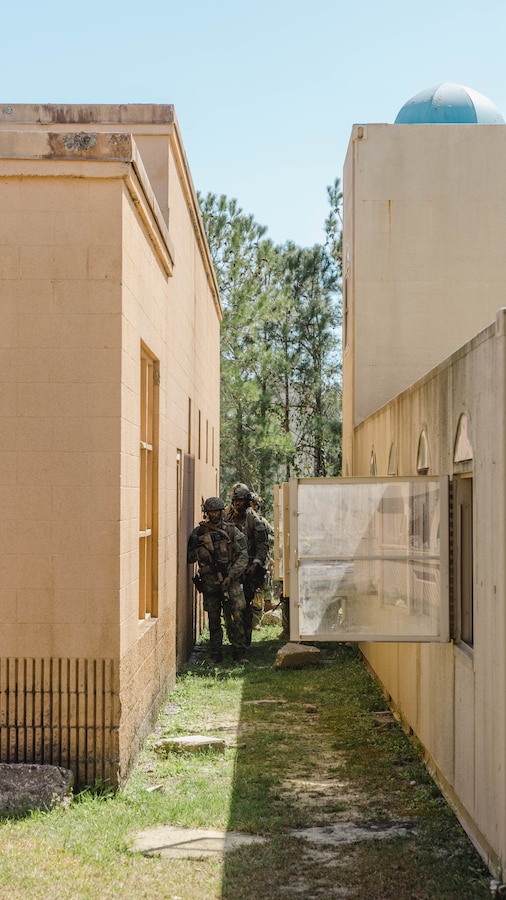 Dutch Marines with Marine Squadron Carib, Netherlands Marine Corps prepare to engage simulated enemies during Exercise Caribbean Urban Warrior on Camp Lejeune, North Carolina, March 21, 2024. Exercise Caribbean Urban Warrior is a bilateral training evolution designed to increase global interoperability between 2d Marine Division and Marine Squadron Carib. (U.S. Marine Corps photo by Lance Cpl. Emma Gray)