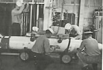 (Left) Weapons Division sailors (presumably GMTs) prepare a B43 thermonuclear bomb for movement from the Special Aircraft Service Stores to an aircraft carrier’s flight deck, circa 1965. (Dept. of Energy’s documentary Always/Never: The Quest for Safety, Control, and Survivability, Part Two).