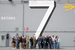 SAN DIEGO (March 14) -- Southwest Regional Maintenance Center (SWRMC) technicians take a group photo with USS Tripoli (LHA 7) officers on the ship’s deck to celebrate the completion of their Selected Restricted Availability on March 12, 2024. The availability completed five days ahead of schedule and was the first large-deck amphibious assault carrier to be repaired without any delays since 2003. Tripoli is an America-class amphibious assault ship homeported in San Diego. SWRMC provides superior ship maintenance and modernization, technical support, training, and innovative solutions to support ship readiness for the Fleet. (U.S. Navy photo by Mass Communication Specialist 2nd Class Olivia Rucker.)
From Left -> Right:
Hideki Asamizu – Project Support Engineer (PSE)
Matt Constantino – Integrated Test Engineer (ITE)
Randy Morris – ITE
Davit White – Shipbuilding Specialist (SBS)
Barry White – Quality Assurance Specialist (QA)
Aaron Rose – Branch Head
Jayson Lagula – PSE
LCDR Joel Hubbard – Program Manager
LTJG Janelle Stewart – Asst. Electrical Officer, TRIPOLI
CDR Kevin Bacon – Chief Engineer, TRIPOLI
CAPT Eddie Park – XO, TRIPOLI
CAPT Gary Harrington – CO, TRIPOLI
CWO4 Chris Atwater – Auxiliaries Officer, TRIPOLI
LCDR Kyle Kuester – Maintenance Office, TRIPOLI
ENS Clinton Atchison – Main Propulsion Assistant, TRIPOLI
Gilbert Vasquez – Asst. Program Manager, CMSD
LT Calvin Stephens – Electrical Officer, TRIPOLI
Bill McMillan – Program Manager, CMSD
Chris Boyle – Area Manager, CMSD
Hector Tirado – QA, CMSD