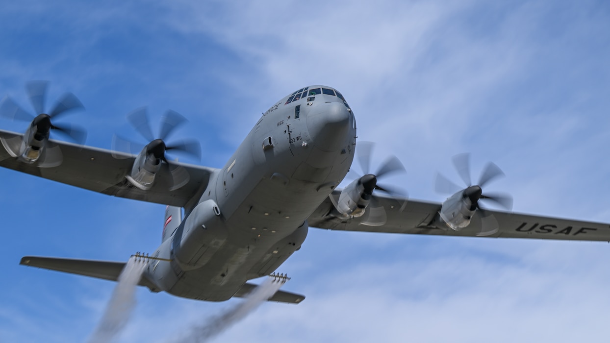 A C-130J-30 Super Hercules aircraft from Keesler Air Force Base, Mississippi, sprays water during a low pass at Youngstown Air Reserve Station, Ohio, as part of a flight test of the 910th Airlift Wing's unique electronic modular aerial spray system, March 25, 2024.