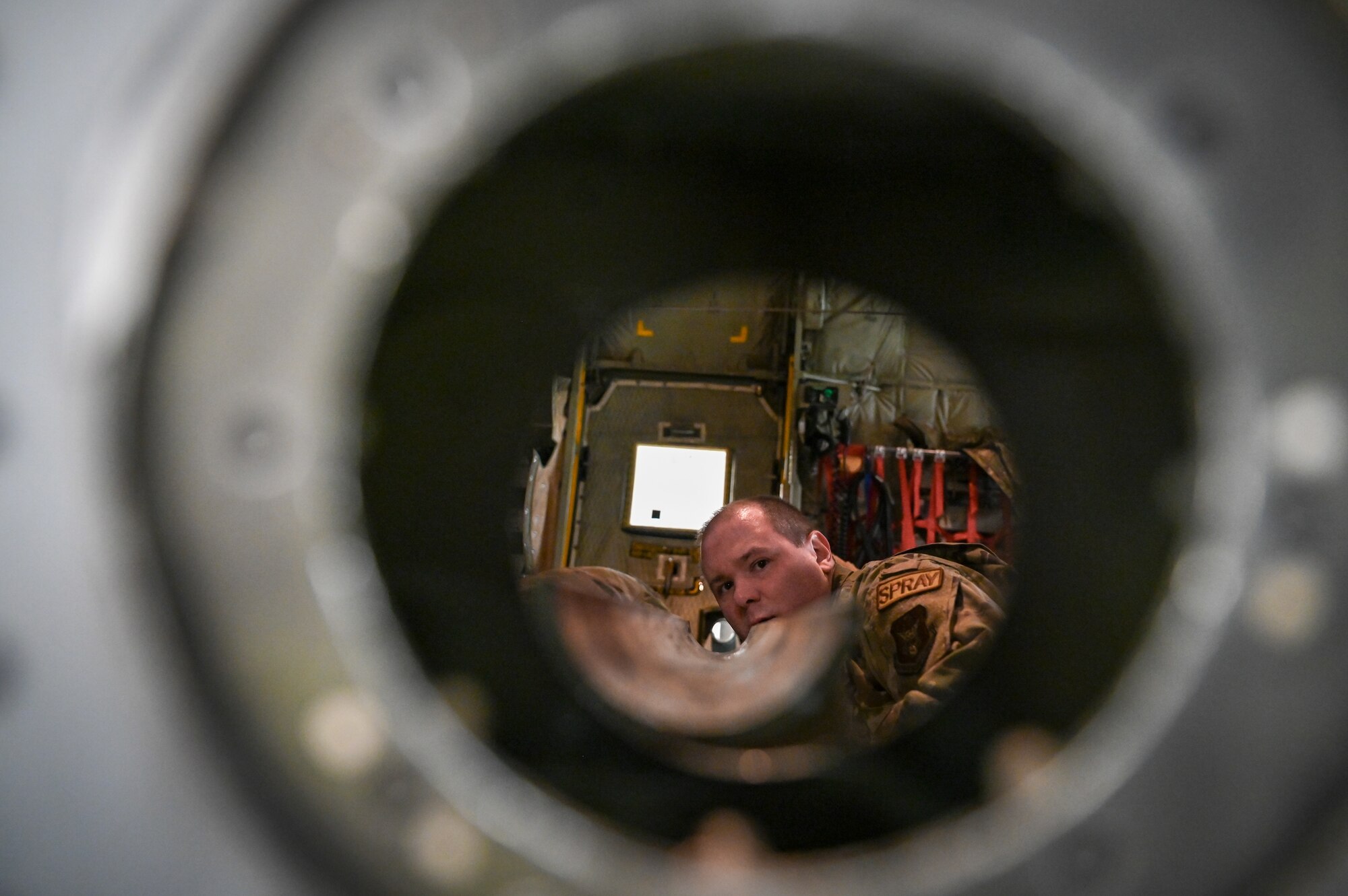 Tech. Sgt. Thomas Wiesen, an aerial spray system maintainer assigned to the 910th Maintenance Squadron, aligns the spray boom sleeve of the 910th Airlift Wing’s electronic modular aerial spray system on board a C-130J-30 Super Hercules aircraft from Keesler Air Force Base, Mississippi, visiting Youngstown Air Reserve Station, Ohio, March 21, 2024.