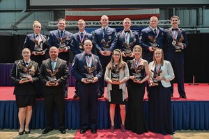 Annual award winners with the 445th Airlift Wing pose for a group photo during the wing’s annual awards banquet at the National Museum of the U.S. Air Force, March 9, 2024.