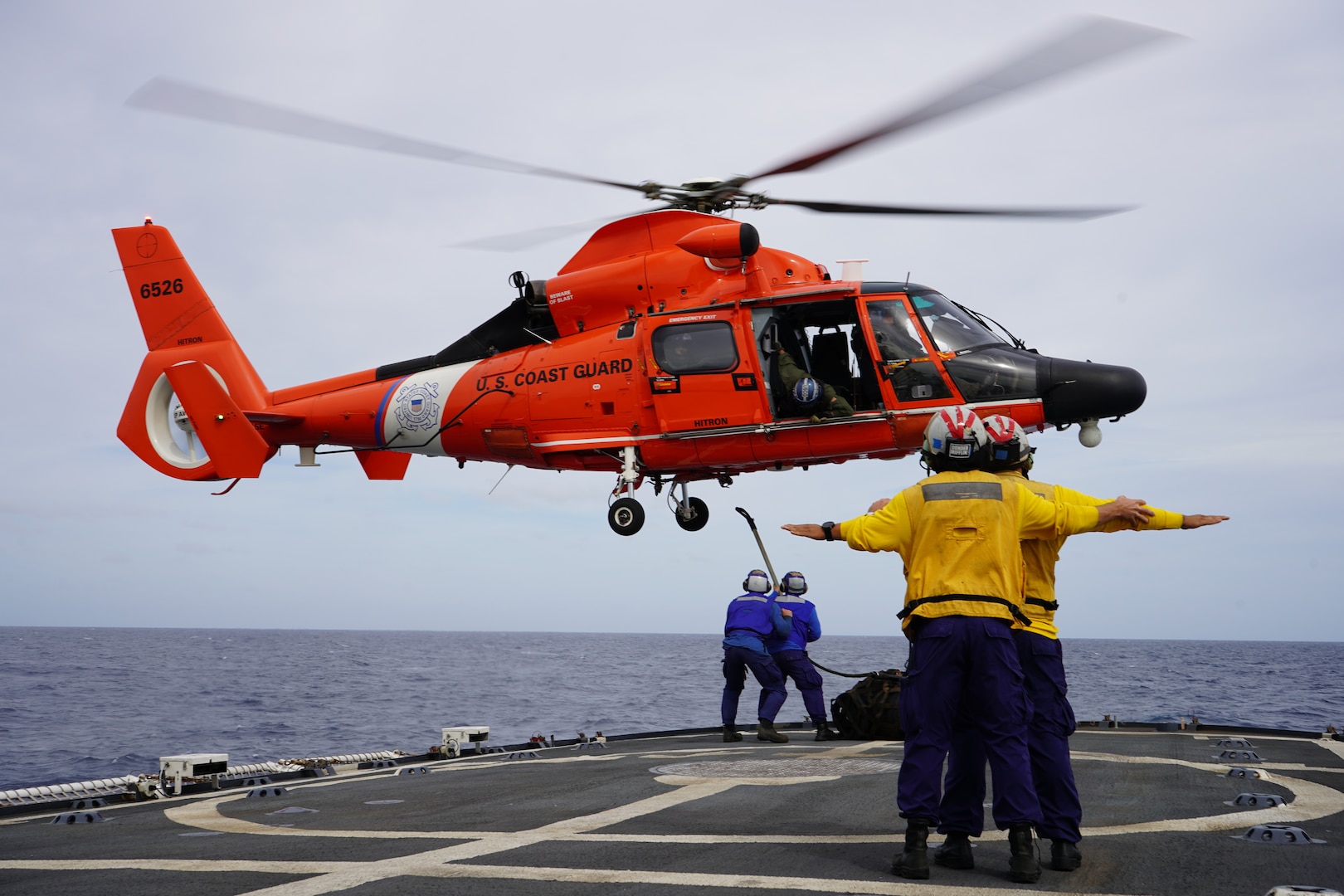 The crew of U.S. Coast Guard Cutter Venturous (WMEC 625) conducts a vertical replenishment evolution off the coast of Fort Lauderdale, Florida, Jan. 25, 2024. This was the first of a three-day deck landing qualification training availability where Venturous trained over 30 personnel from surrounding units.